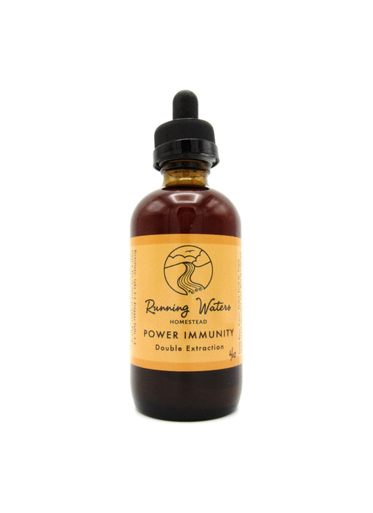 A bottle of Power Immunity tincture with a dropper, featuring a label with orange and yellow accents and a logo.